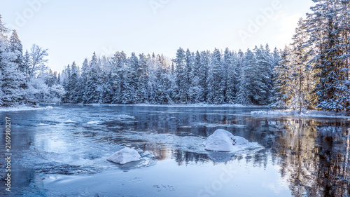 River landscape in a cold morning with snow and frost. Farnebofjarden national park in north of Sweden