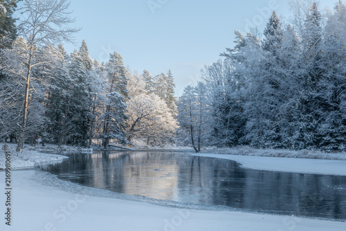 River landscape in a cold morning with snow and frost. Farnebofjarden national park in north of Sweden