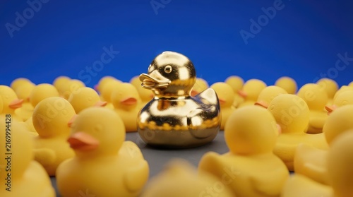 A prominent singular metallic golden duck stands out from a crowd of ordinary yellow rubber ducks placed against a solid vibrant blue background
