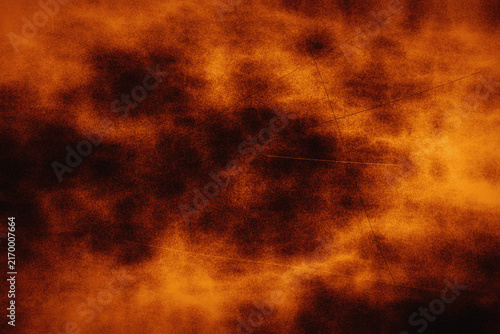 Cuadro en lienzo Vibrant orange fire smoke background with intense glowing colors and dark shadows serves as an energetic texture for posters or digital artwork design