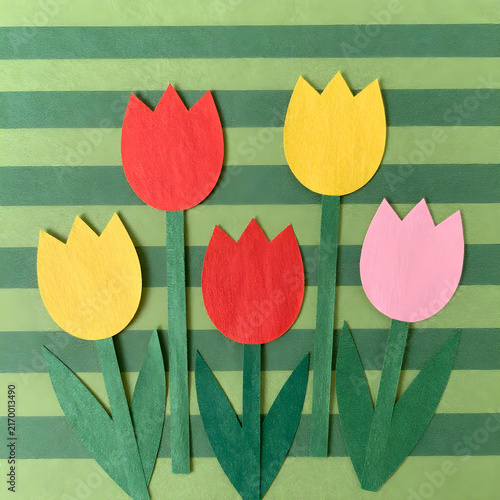 Vibrant Handmade Paper Tulips Blooming Against Geometric Green Striped Background in a Cheerful Spring Flat-Lay Composition