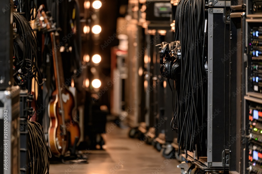 Fototapeta premium Backstage with music equipment, cables, and instruments