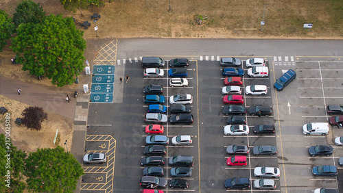 Aerial view of Corley Northbound Services M6 featuring a busy parking lot with numerous cars and designated EV charging zones in Coventry, England, United Kingdom.