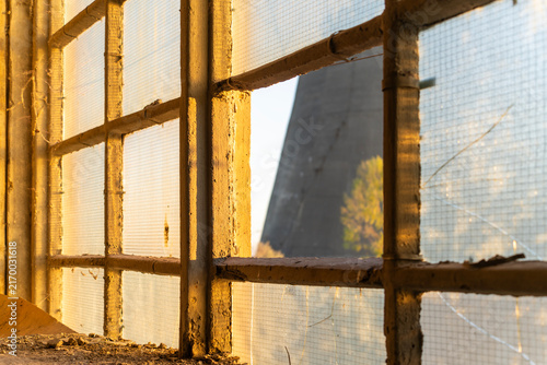 Canvas Print Abandoned broken window of an old power plant