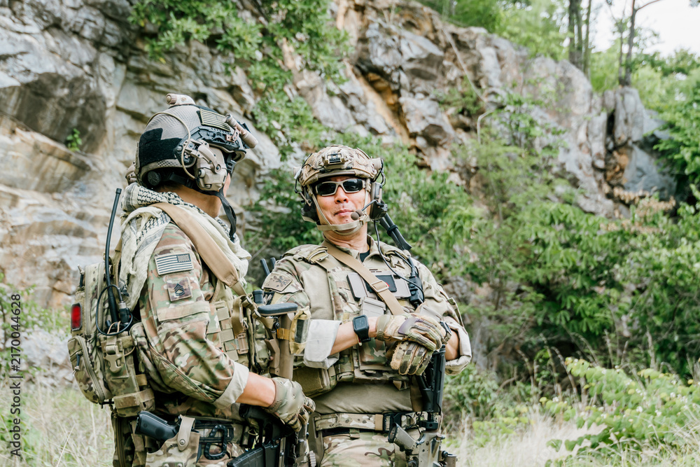 Fototapeta premium Outdoor soldiers jungle soldiers soldiers duty alert concentrated focused determined watchful professional tactical military combat patrol mission