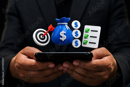 Businessman holding a smartphone with floating 3d of a money bag, target with arrow, dollar coins, and a checklist on a dark background