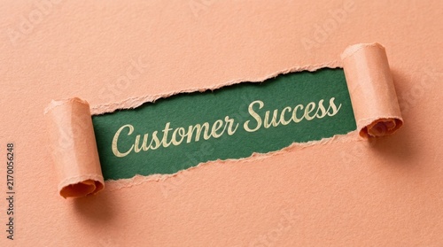 Customer Success Text Appearing Through Torn Brown Paper Hole