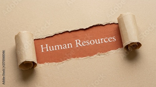 Human Resources Text Revealed Under Torn Brown Craft Paper