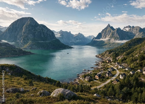 Stunning landscape view of a small fishing village nestled between steep mountains and a deep blue fjord in northern Norway