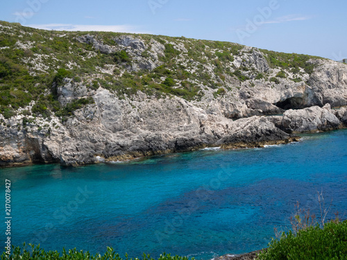 Obraz na płótnie Rocky Porto Limnionas coastline in Zakynthos, Greece, with clear blue Ionian Sea