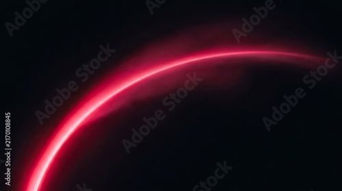 Bright magenta light arc against dark background with gradient glow effect with soft gradient illumination curves smoothly across across deep black lightingdesign lightsource illuminated radiant