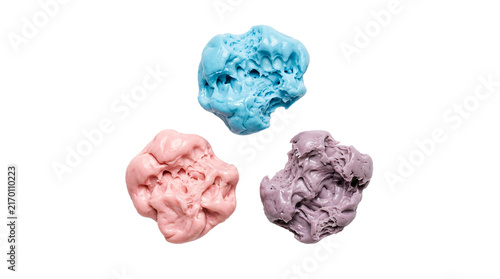 Foto Three colorful mounds of soft stretchy modeling clay in bright blue pink and pur