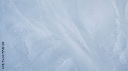 Macro frost patterns and ice crystals on winter window glass