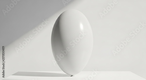 Minimalist White Balloon Floating Against a Clean Architectural Background in Soft Natural Light