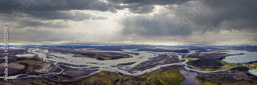 фотографія Aerial view of braided glacial rivers and meltwater lakes, Rangarthing ytra Icel