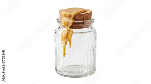 Creamy peanut butter dripping on glass jar, organic nut butter spread on cork lid, delicious breakfast ingredient isolated PNG with Transparent Background