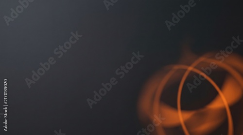 Blurred orange light trails on a dark gray background