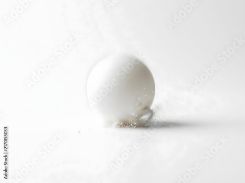 White Ball Impact on Surface with Dust Particles