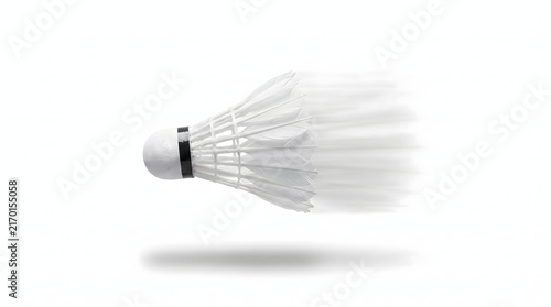 White Shuttlecock in Flight Over White Background