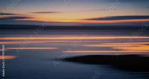 Sunset seascape with horizontal motion blur.