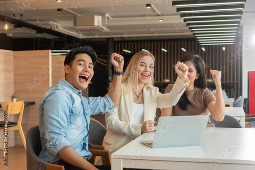 Group of powerful diversity creative people high five on air to greeting power of team. Multiethnic businesspeople working together. Collaboration in Business Team success. StrongTeamwork concept.