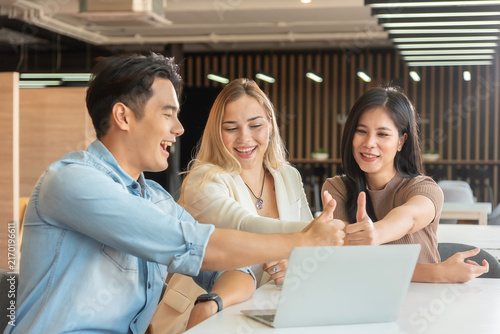 Group of powerful diversity creative people high five on air to greeting power of team. Multiethnic businesspeople working together. Collaboration in Business Team success. StrongTeamwork concept.