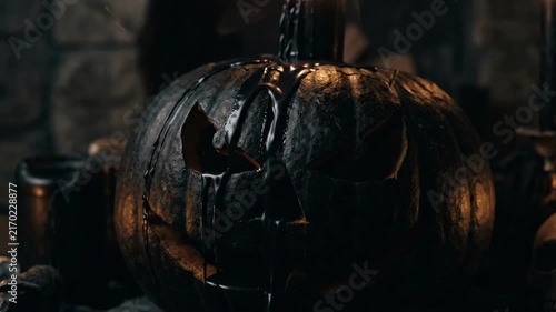 Spooky 4K Cinematic Black Jack-o'-Lantern with Oozing Dark Tar Dripping in a Haunted Gothic Chamber Background Seamless Loop