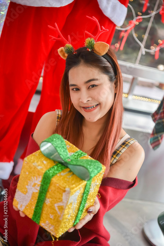 Happy woman in red sweater holding many boxes, Gift box in female hands. Holiday, gift, Holiday gift surprise, Merry Christmas and Happy new year season.