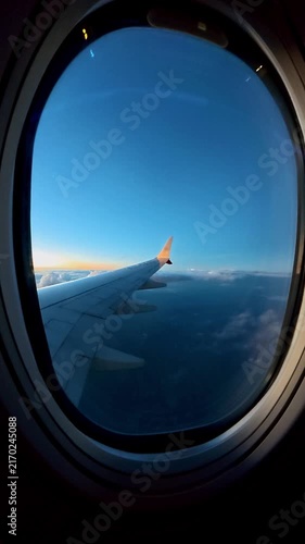 Airplane flying over the colombian andes during sunrise