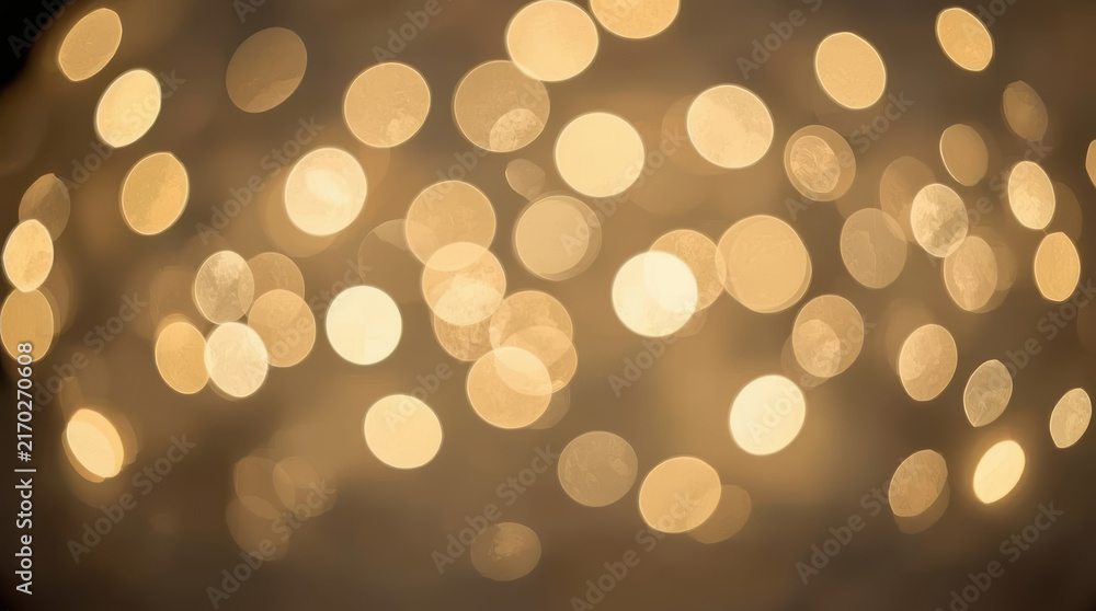 Fototapeta premium Warm golden bokeh light background creating soft glowing atmosphere