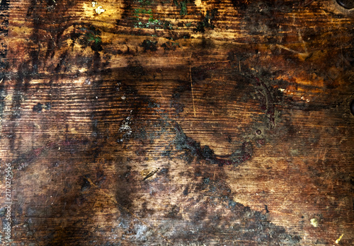 Canvas Print Heavily distressed dark wood surface with deep water stains oil grime and rough