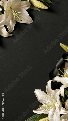 Solemn Remembrance: Elegant white lilies and a black ribbon are artfully arranged on a dark, textured background.