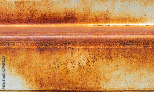 Принти на полотні Heavily rusted metal surface texture background with orange corrosion and weathe