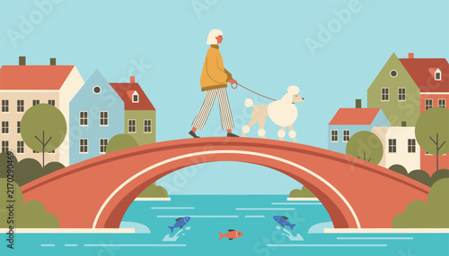 Woman in stylish warm clothes walks her elegant white poodle across a red brick bridge over a river with swimming fish.