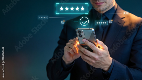 Businessman Using Smartphone with Five Star Customer Rating and Review Interface for Digital Reputation, Customer Satisfaction and Online Business
