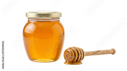 jar of honey with wooden dipper