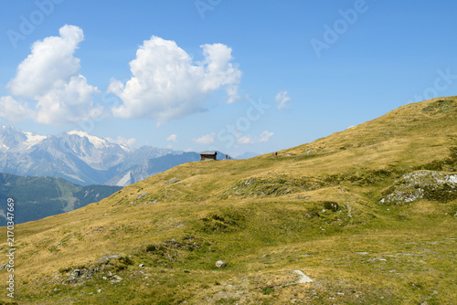 Mountain Landscape With Alpine Hut and Clouds