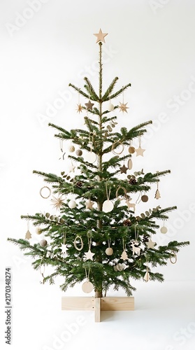 Minimalist Christmas tree decorated with natural ornaments and soft lights