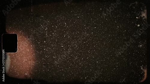 Dark textured background with vintage film grain and light scratches for retro design