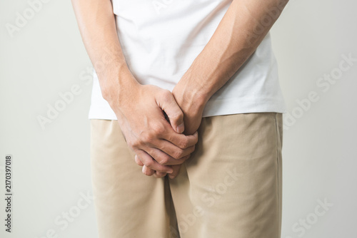 Konstfotografi Closeup annoying itch asian man with an itchy his jock and butt, male scratching crotch with his hand, itching groin, male suffering body problem
