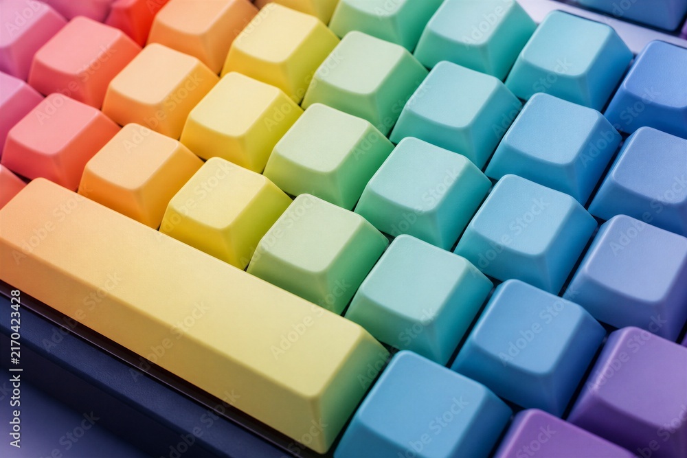 Obraz premium Rainbow keycaps arranged on mechanical keyboard closeup