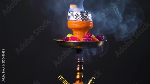 A hookah with fruit and smoke
