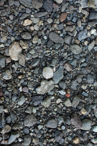 Bild auf Leinwand Pebbles are scattered haphazardly on the ground.