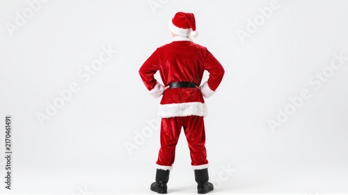 Rear view of person in red Santa suit with hands on hips on white background, with santa, suit, hat, rear detail, showing backview, hand, hips, stance context