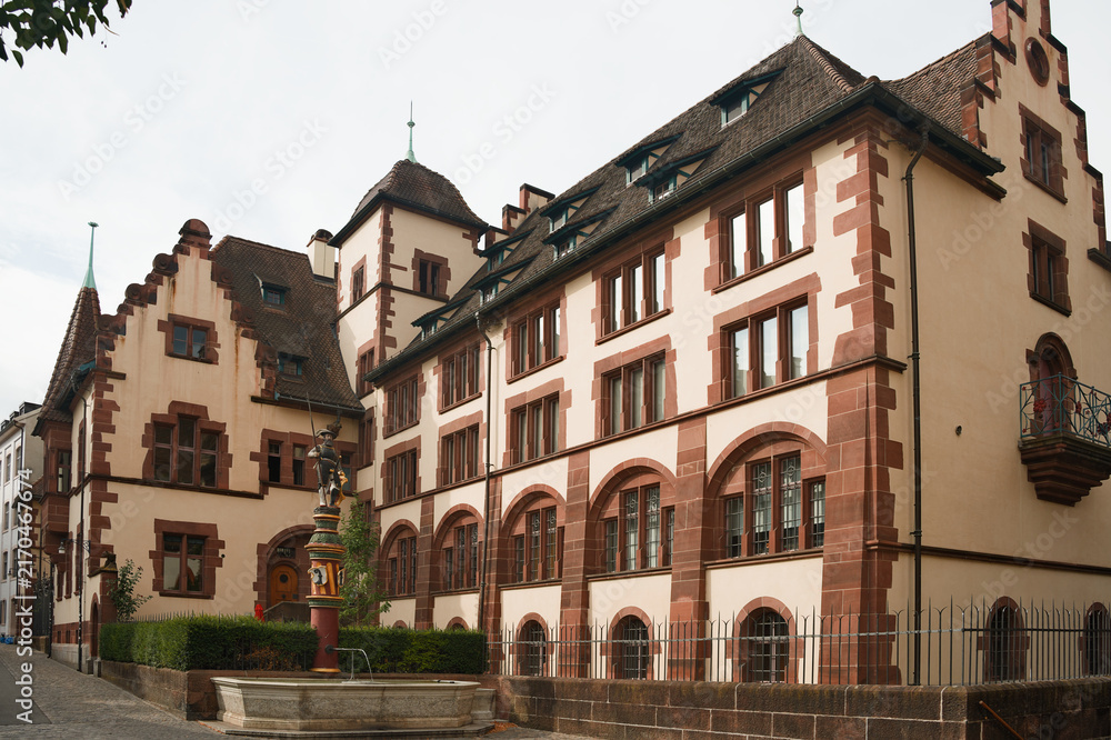 Obraz premium Sevogelbrunnen Fountain and Historic State Archives Building in Martinskirchplatz Square in Old Town Basel Switzerland