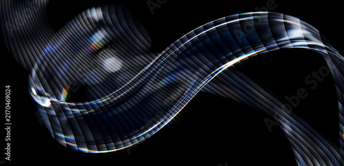 Abstract flowing wave shape with dark metallic stripes and light reflections on black background with ribbons light refractions refractions against deep wave form composed