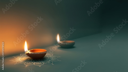 Happy Diwali Two glowing clay diya lamps placed on a simple white mandala pattern on a dark surface with soft warm lighting and copy space