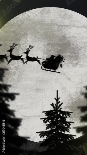 Yellow christmas string lights flashing over trees and santa passing full moon in sleigh