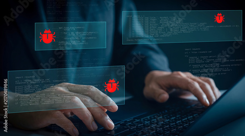 Fotografie Software developer working on a laptop finding  bug or virus in codes