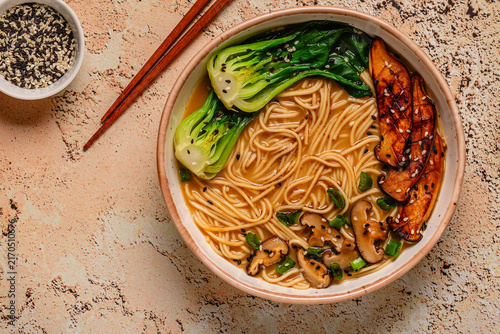 Cuadro en lienzo Vegan miso ramen noodle soup with eryngii and shiitake mushrooms, pak choi cabba